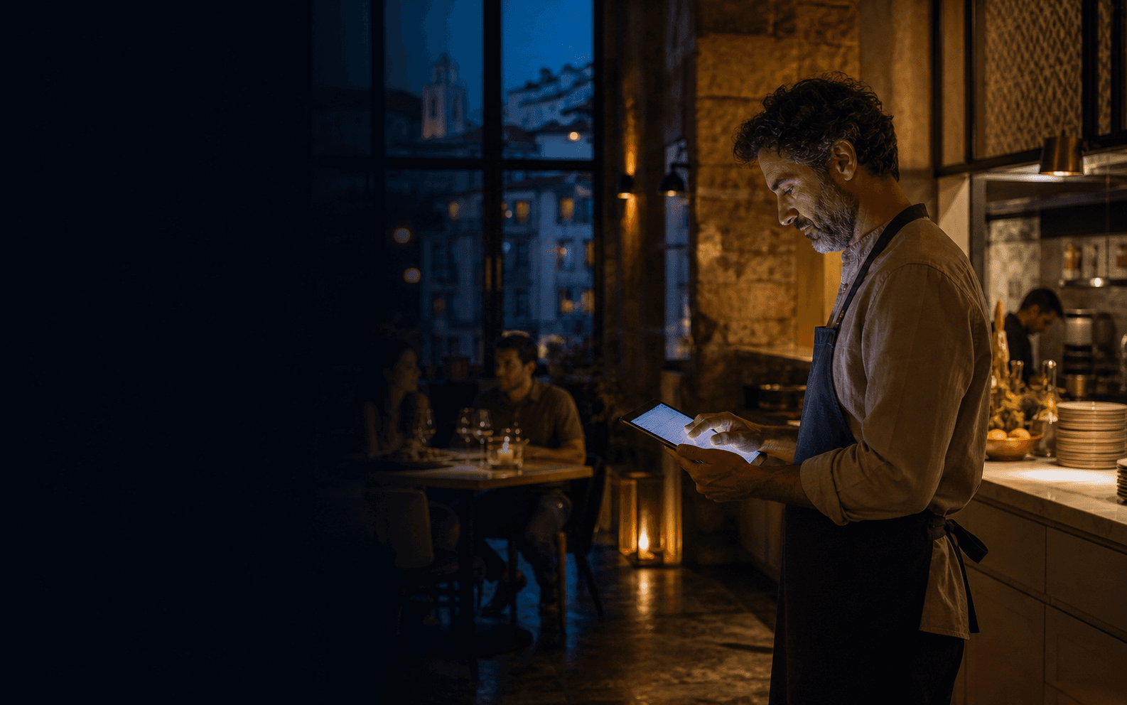 Restaurant owner managing service on a tablet